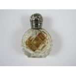 A Victorian white metal capped cut glass perfume bottle