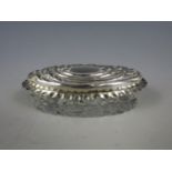 A silver topped pin dish