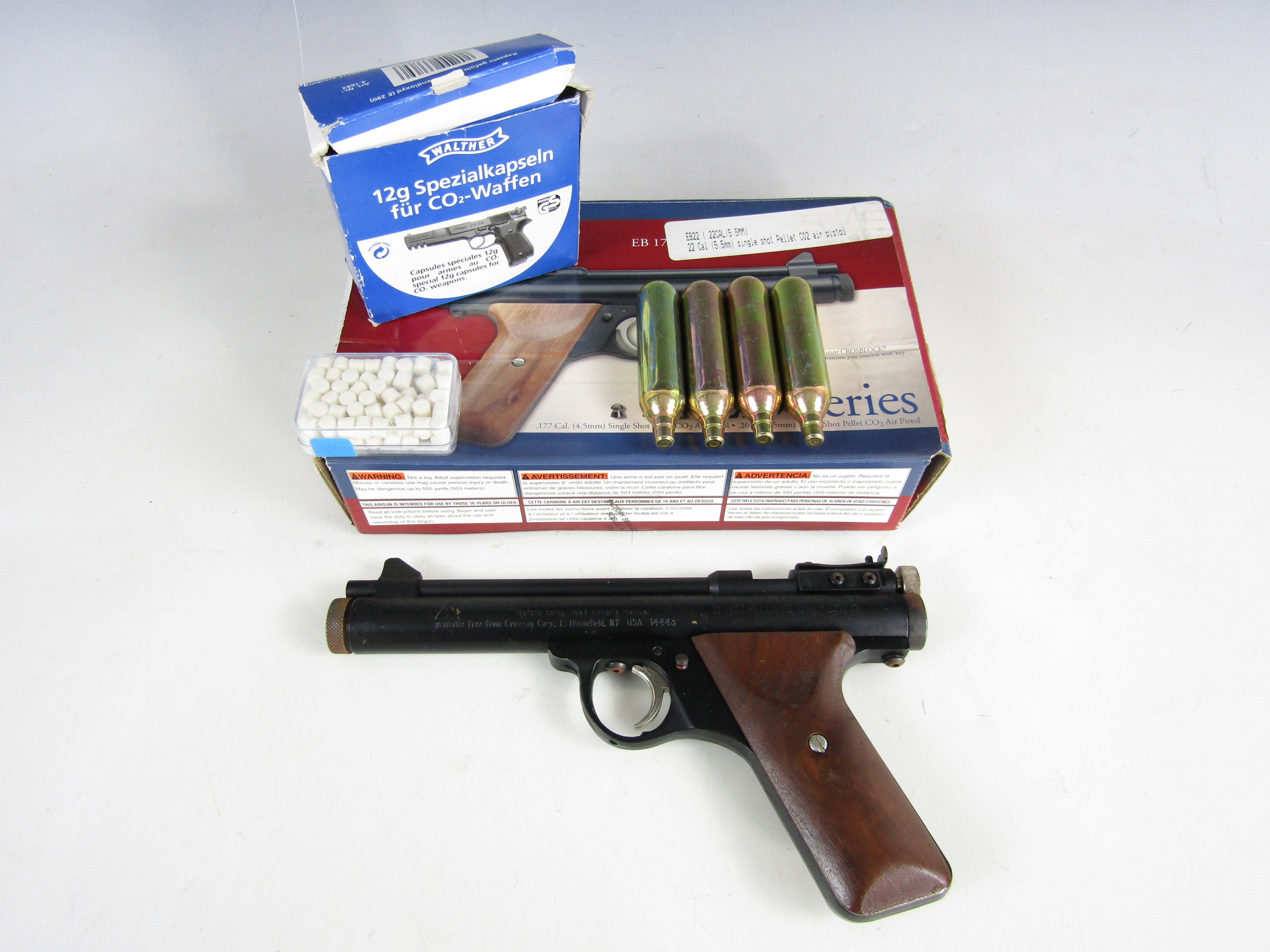 A boxed Benjamin EB22 gas cartridge air pistol and accessories