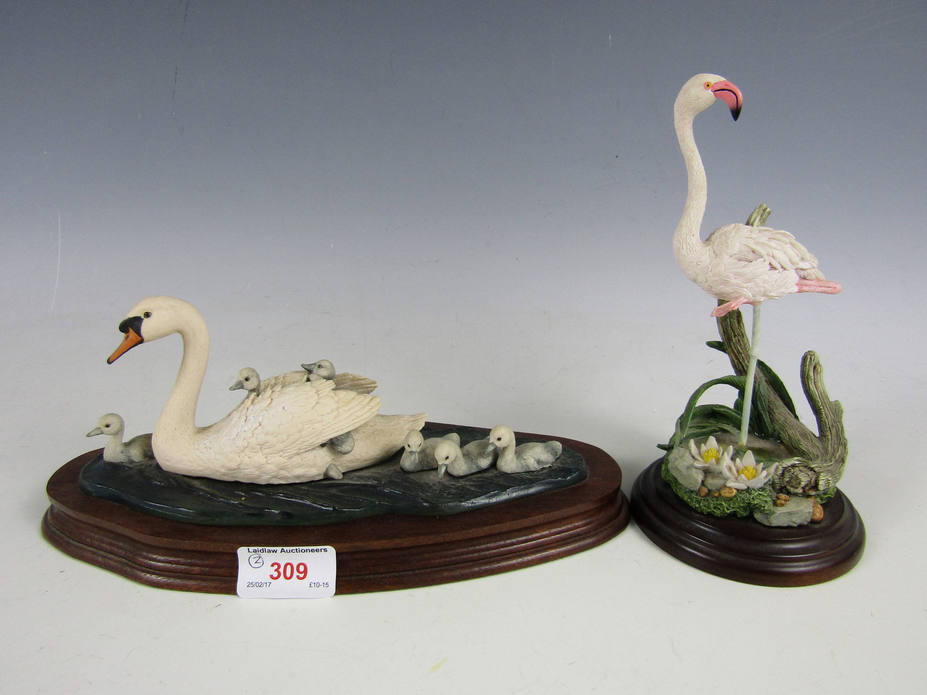 A Border Fine Arts figurine of a swan and signets together with one further Country Artists figurine