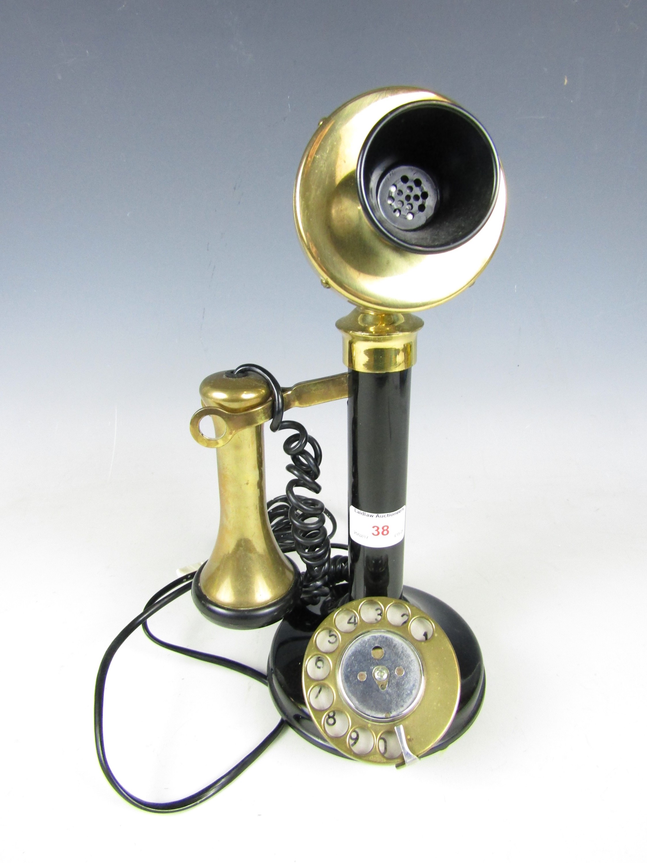 A reproduction candlestick telephone