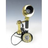 A reproduction candlestick telephone