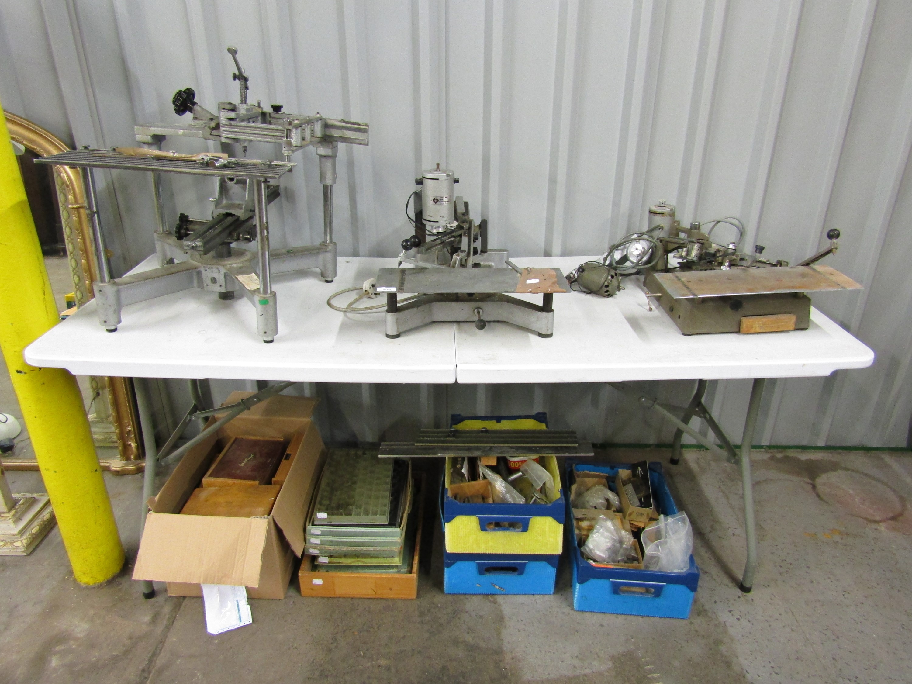 Three engraving machines with letter sets and other accessories