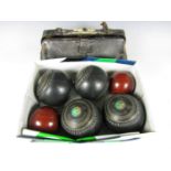 A set of four Greenmaster bowls, size 5 together with two cased bowls and two carpet bowls