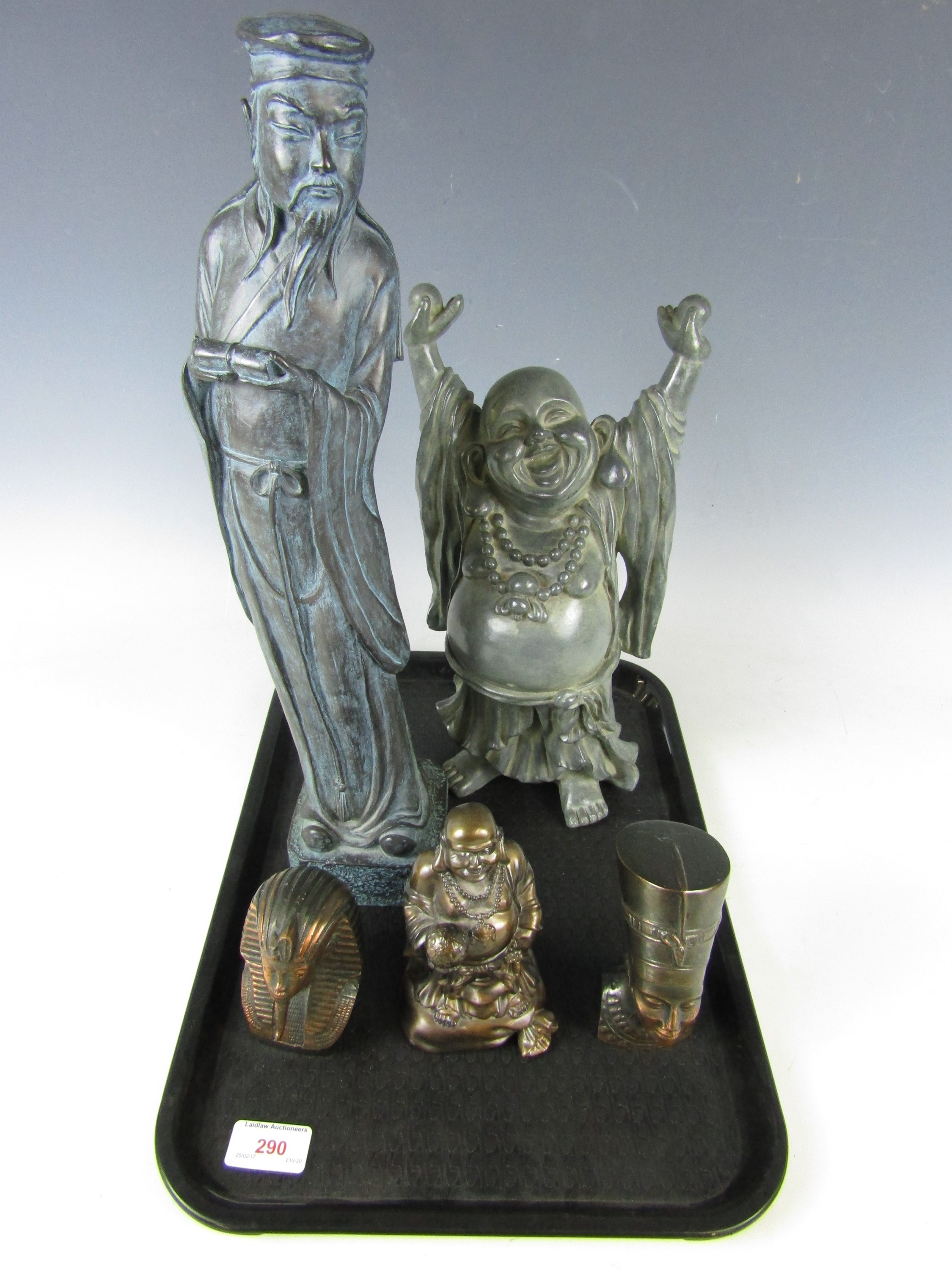 A cast figurine of a Chinese sage, together with two similar laughing Buddha figurines and two