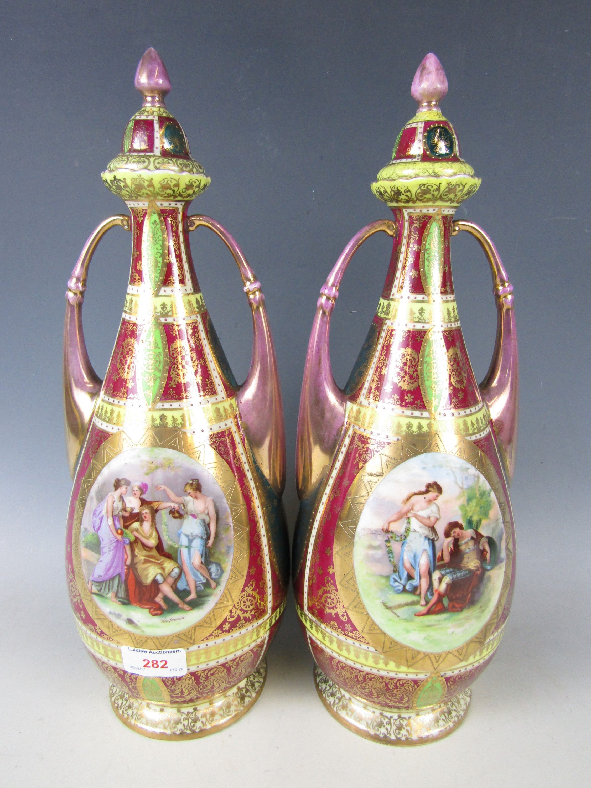 A large pair of 19th century Vienna gilt-enriched lustre porcelain vases depicting courting