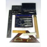 Various cased drawing instruments together with set squares etc