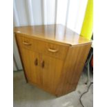 A teak corner bureau