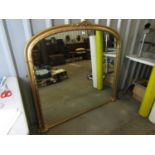 A large contemporary reproduction Victorian gilt overmantle mirror