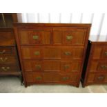 A large contemporary mahogany chest of drawers