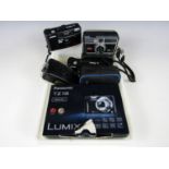 A Panasonic Lumix TL18 camera together with five others