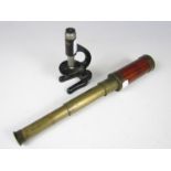 A Victorian brass telescope together with a vintage Octopus toy microscope