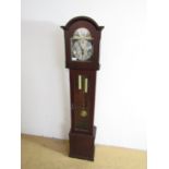 A reproduction grandmother clock