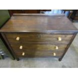 An oak three drawer chest