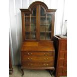 A 1920's oak bureau bookcase