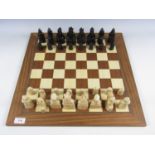 An Isle of Lewis chess set and string-inlaid hardwood board
