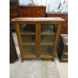 A glazed oak bookcase