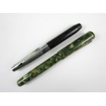 A vintage Selfridges fountain pen together with one other