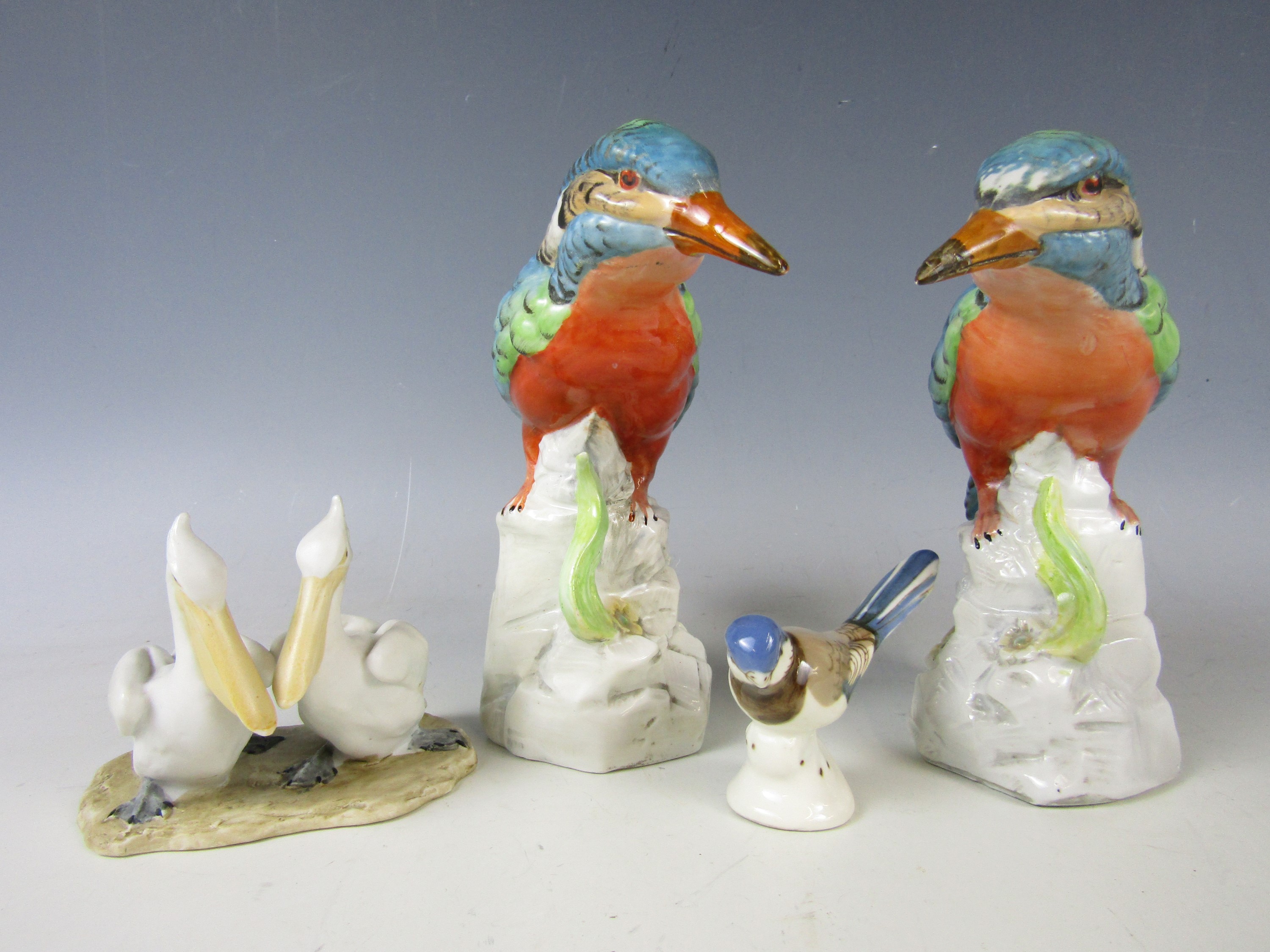 Four various bird figurines