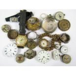 A quantity of vintage watch movements and silver watch cases