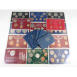 A quantity of cased GB coin sets