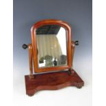 A Victorian mahogany swivel toilet mirror