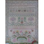 A large embroidered needlework sampler