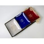 A boxed set of three Queen Elizabeth II Coronation commemorative glass dishes