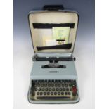 A cased Olivetti Lettera 22 portable typewriter