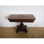 A George IV mahogany pedestal card table