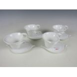 Four Franz boxed cabinet cups and saucers