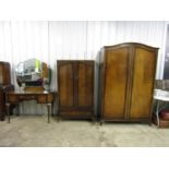 A three-piece mahogany bedroom suite