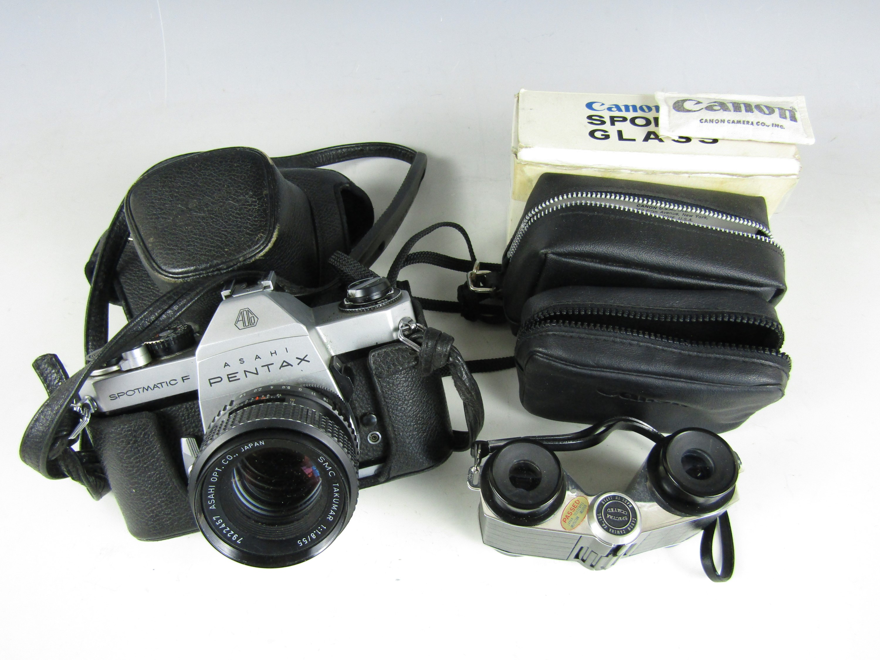 A vintage pair of Canon 3X sports glasses together with a Pentax Spotmatic F camera