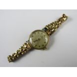 A lady's 9ct gold cased Cyma wristlet watch, on a rolled gold bracelet strap