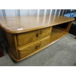 An Ercol oak coffee table, 124 x 40 x 54 cm