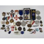 A quantity of lapel badges and medallions