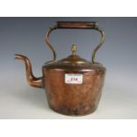 An antique copper kettle