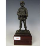 A cold cast bronze sculpture of a late 20th Century British infantryman, 29 cm high