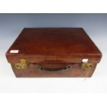 An early 20th Century hide vanity case with fitted interior