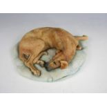 A boxed Border Fine Arts figurine of a recumbent Great Dane, 077 1985