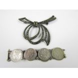 A vintage silver threepenny bit coin bracelet together with a white metal marcasite brooch in the