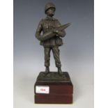 A cold cast bronze sculpture of a late 20th Century Royal Artillery gunner, 31 cm high