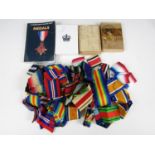 A quantity of medal ribbons, medal cartons and a medal collectors' guide