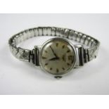 A lady's vintage stainless steel Longines wristwatch, with circular silvered face and rhombus