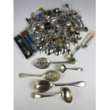 A large quantity of collectors' spoons together with sundry serving spoons etc.