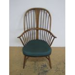 An Ercol Windsor armchair with crinoline stretcher