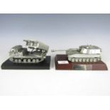 A die-cast model of an MLRS tank, together with one other of a M109 tank