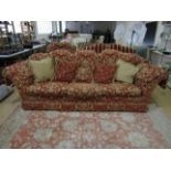 A contemporary two piece suite of large three seater sofa and matching armchair, both upholstered in