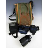 A Sigma mirror telephoto lens (a/f) together with four camera bags
