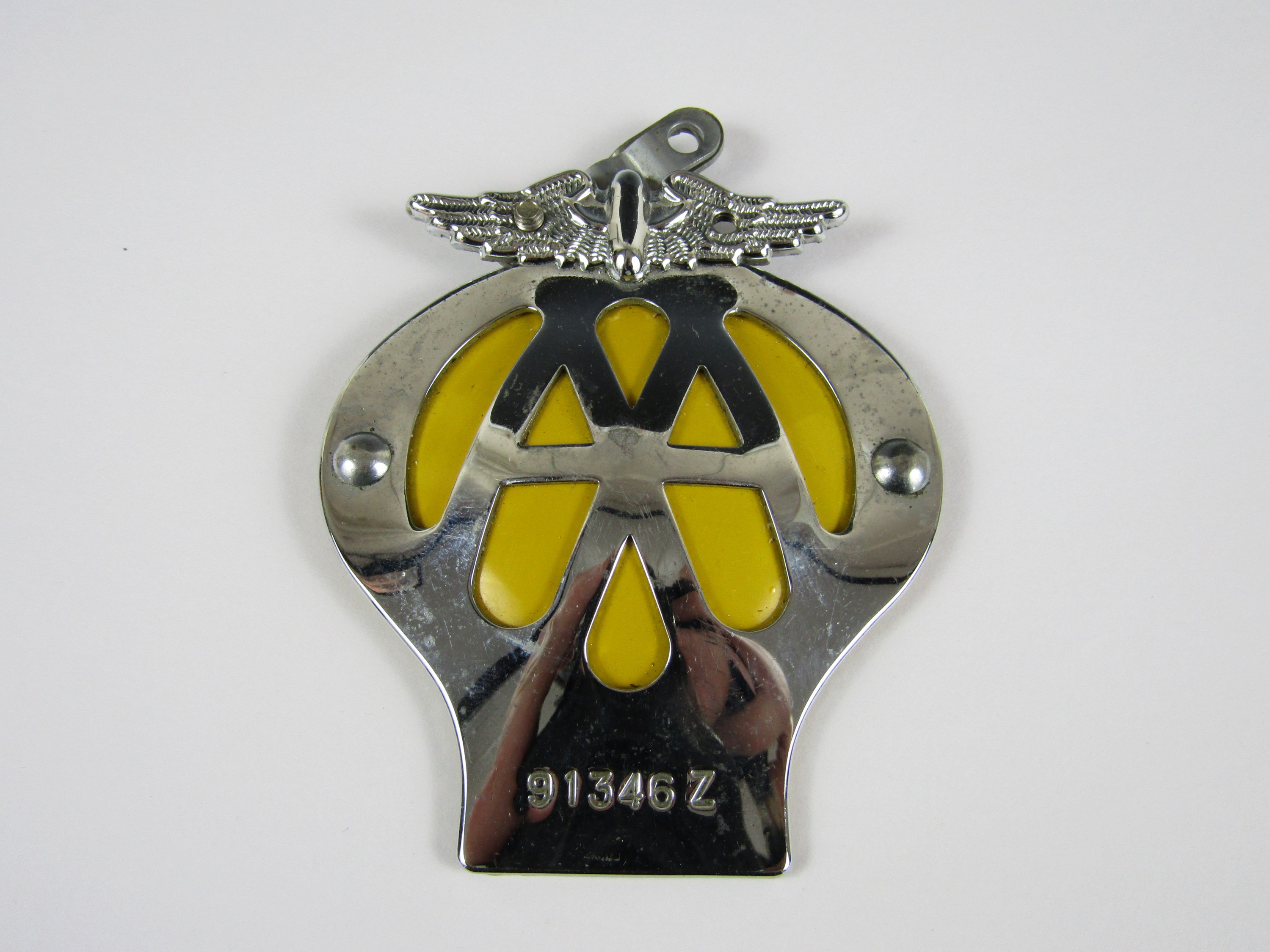 A vintage AA motorcycle badge